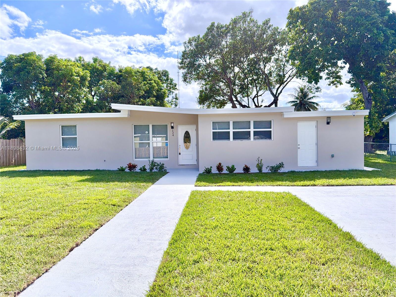 124 Harvard Road West Park, FL 33023 - Photo 1 of 75 a view of outdoor space yard and front view of a house