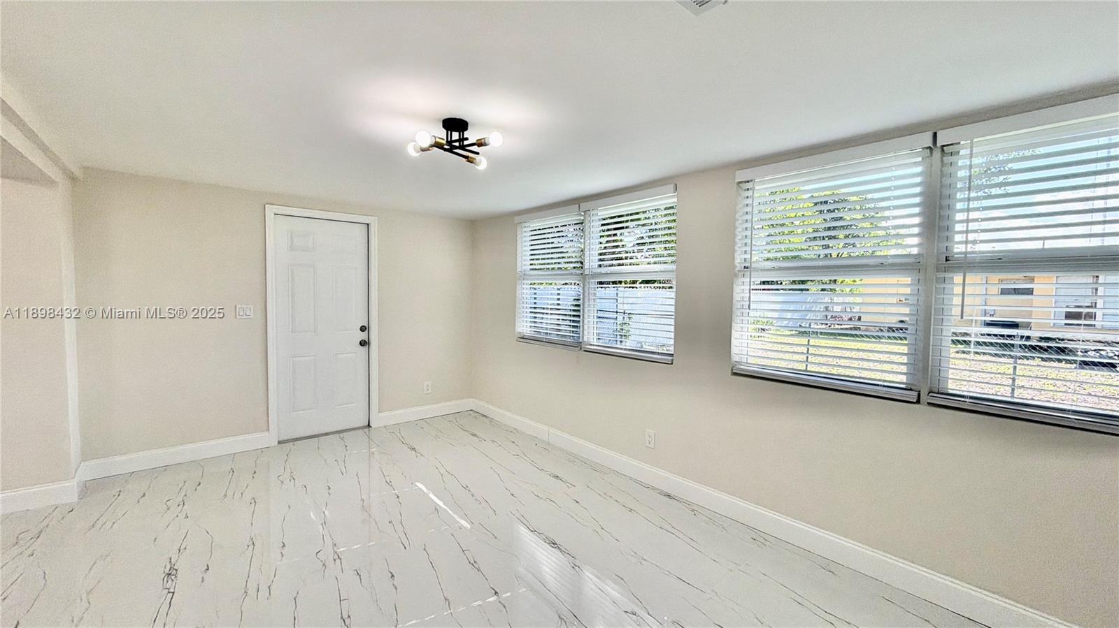 124 Harvard Road West Park, FL 33023 - Photo 19 of 75 a view of an empty room with a window