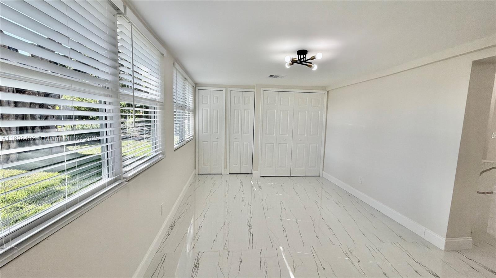 124 Harvard Road West Park, FL 33023 - Photo 21 of 75 a view of a room with wooden floor
