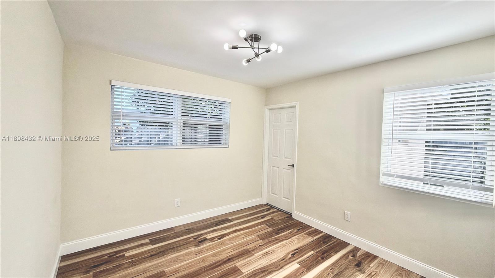124 Harvard Road West Park, FL 33023 - Photo 30 of 75 a view of a room with a ceiling fan and a window