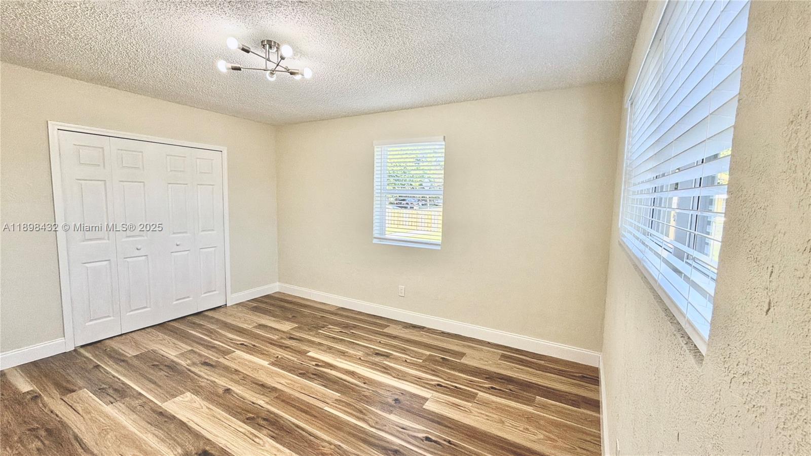 124 Harvard Road West Park, FL 33023 - Photo 39 of 75 a view of an empty room with a window