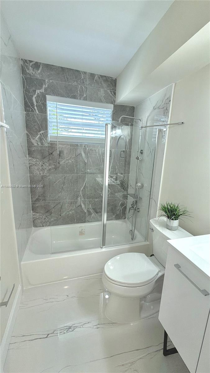 124 Harvard Road West Park, FL 33023 - Photo 41 of 75 a bathroom with a toilet and a shower