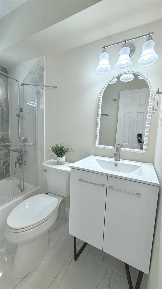 124 Harvard Road West Park, FL 33023 - Photo 42 of 75 a bathroom with a sink a toilet and shower