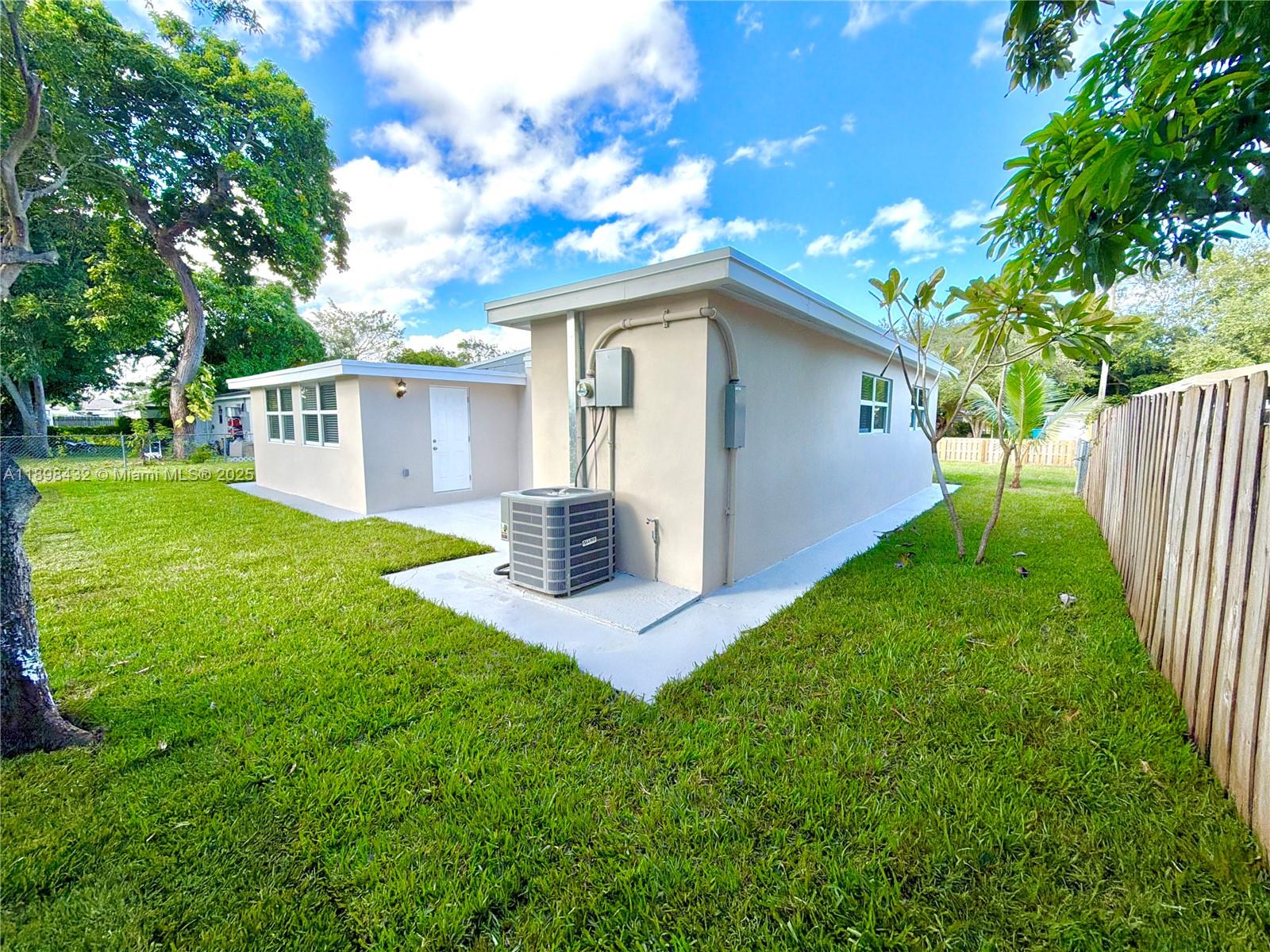 124 Harvard Road West Park, FL 33023 - Photo 53 of 75 a front view of house with yard and green space