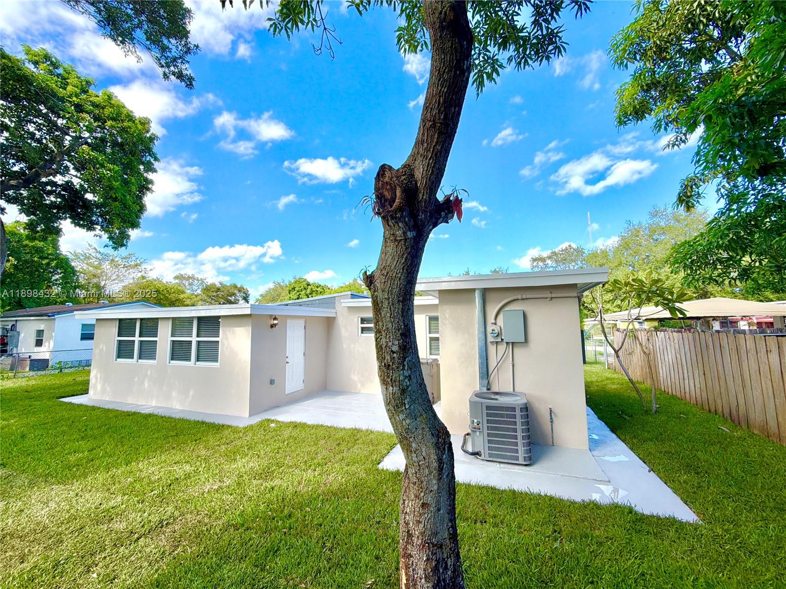 124 Harvard Road West Park, FL 33023 - Photo 59 of 75 a front view of a house with garden