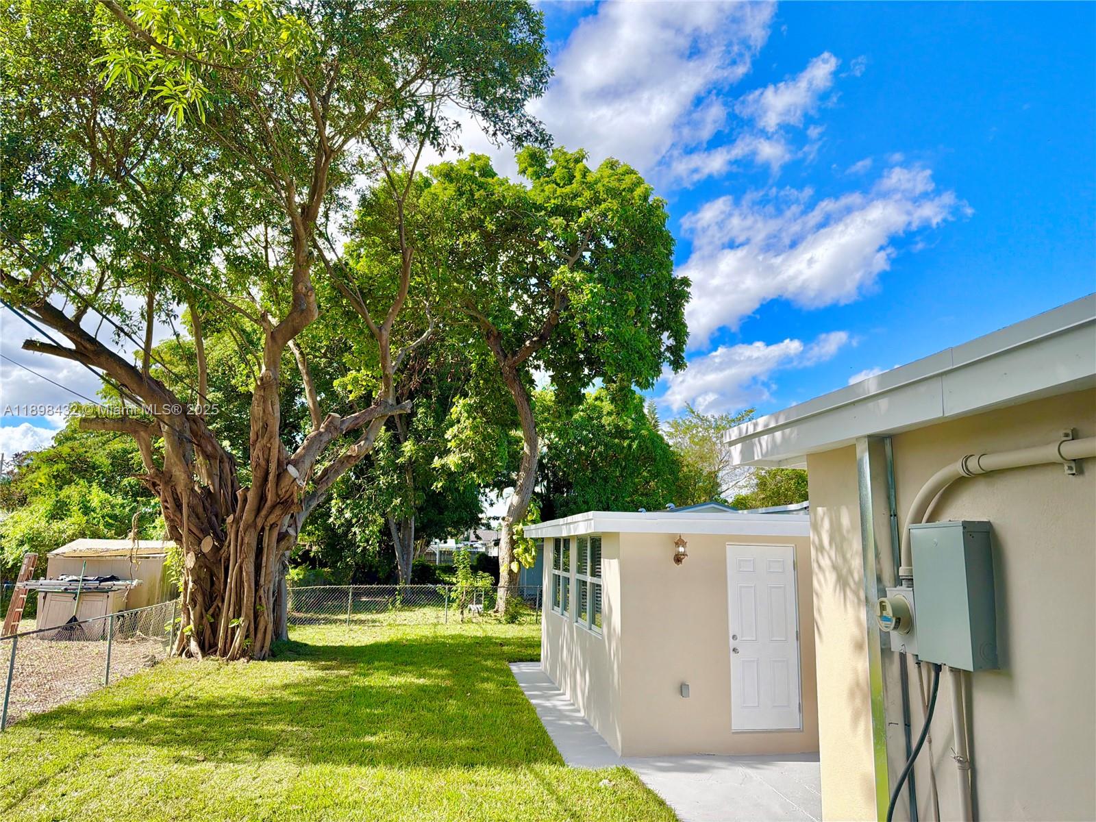 124 Harvard Road West Park, FL 33023 - Photo 61 of 75 a view of a house with a yard