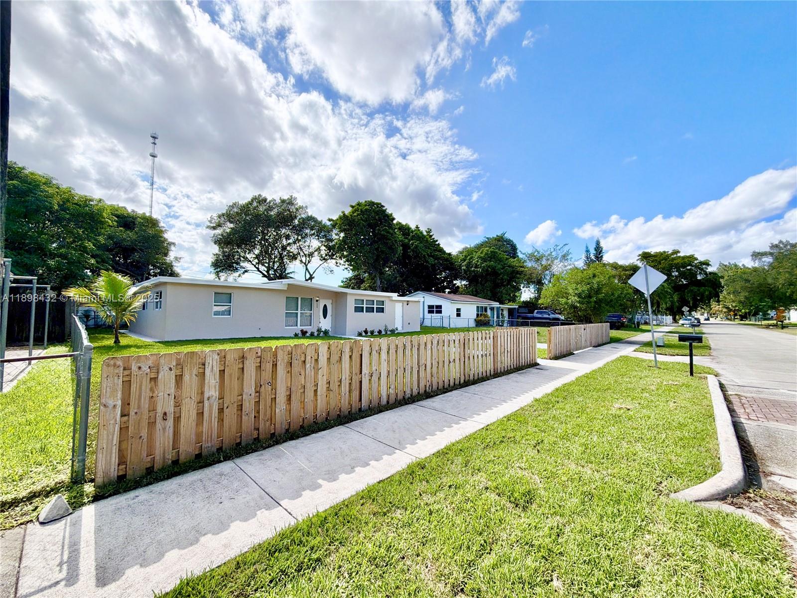 124 Harvard Road West Park, FL 33023 - Photo 68 of 75 a view of a backyard with sitting area