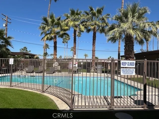 a view of a swimming pool with a garden