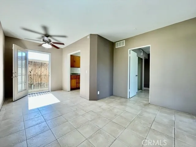 a view of an empty room with a fireplace