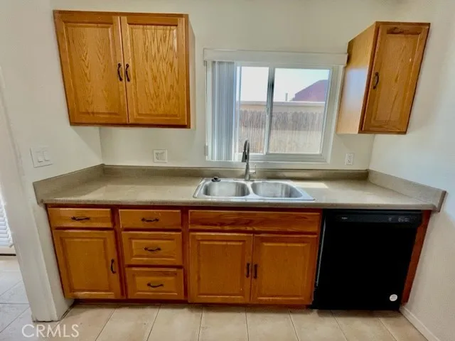 a kitchen with a sink and a window