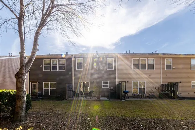a view of a livingroom with a ceiling fan and window