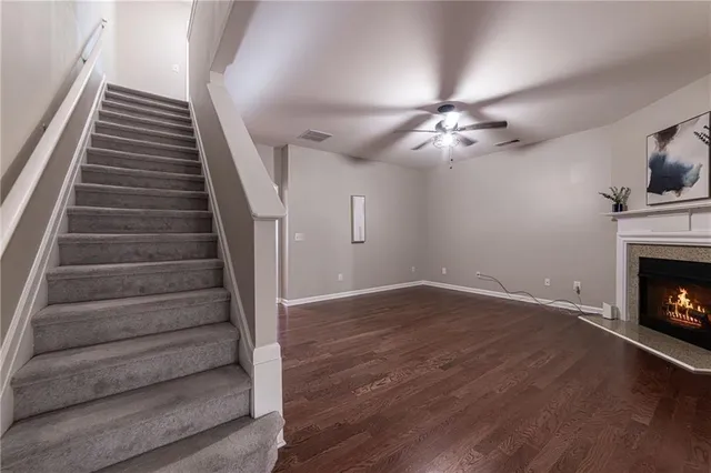 a bathroom with a double vanity sink toilet and a mirror
