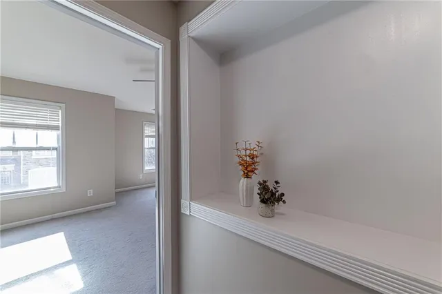 a bathroom with a bathtub shower and window