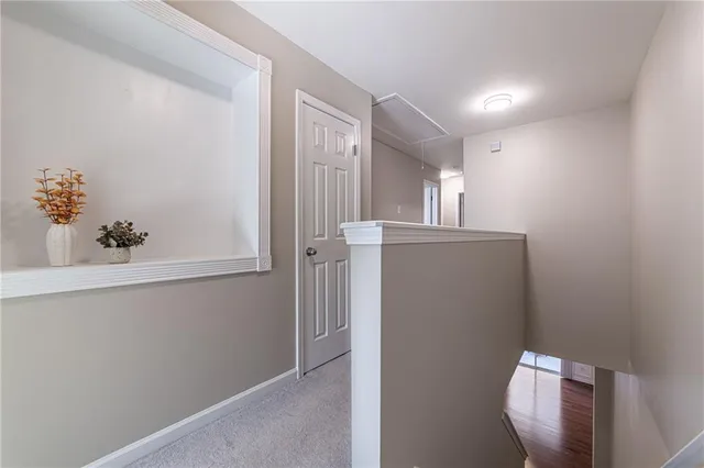 a bathroom with a sink a light fixture and a mirror