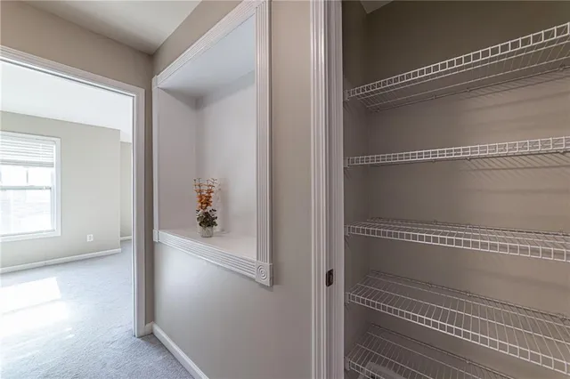 a view of a room with racks on the wall