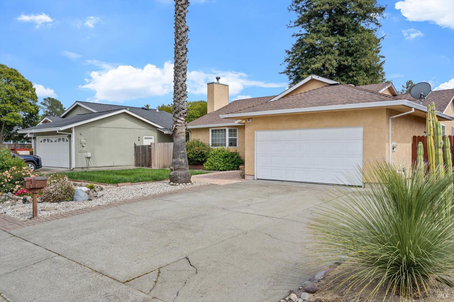 971 Eleanor Avenue Rohnert Park, CA 94928 - Photo 3 of 25 a view of a house with a yard and potted plants