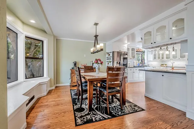 a workspace with wooden floor and a window