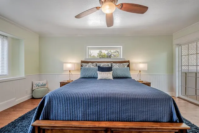 a spacious bathroom with a granite countertop sink mirror and a shower
