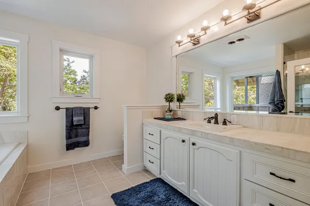 an empty room with a cabinet and a window