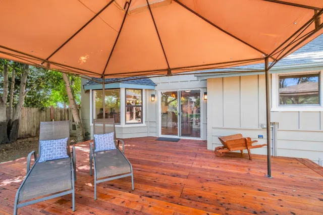 a view of a backyard with sitting area
