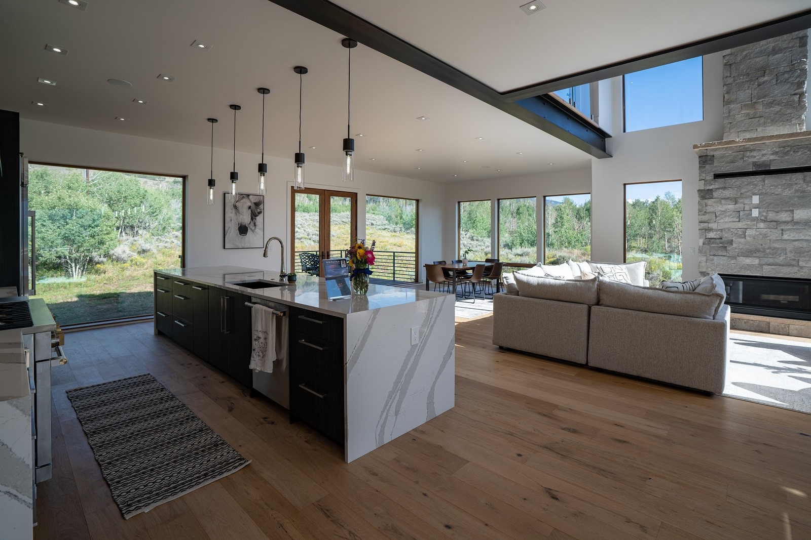 2150 Elk Run Road Silverthorne, CO 80498 - Photo 4 of 29 Great Room featuring a wealth of natural light, European white oak hardwood floor, and quartz island.