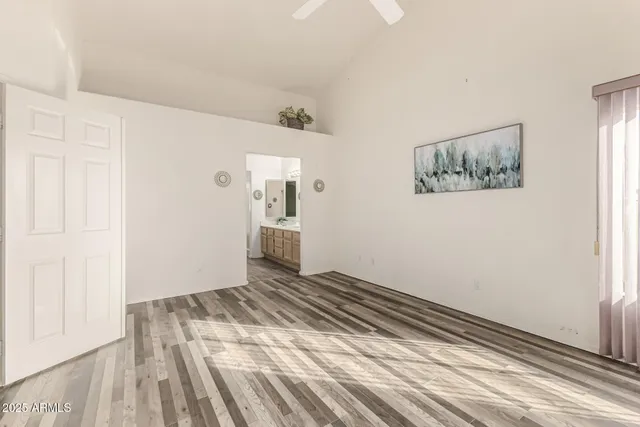 a view of a dining room with furniture and a chandelier