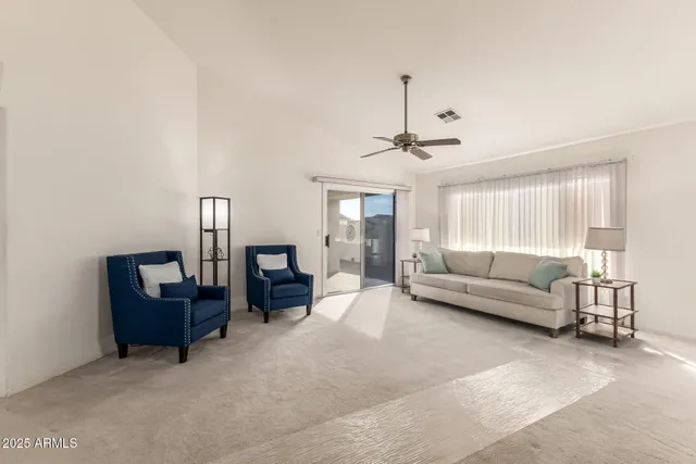 a view of a dining room with furniture and window