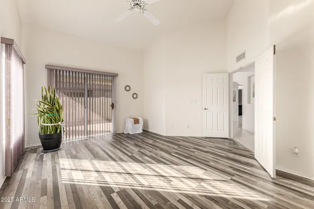 a view of a patio with table and chairs and potted plants