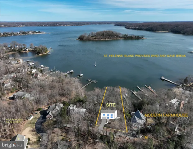 an aerial view of a houses with ocean view