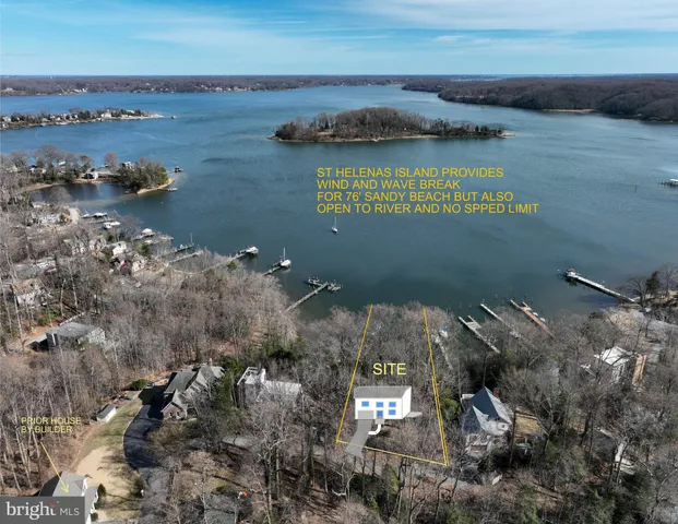 an aerial view of a houses with ocean view