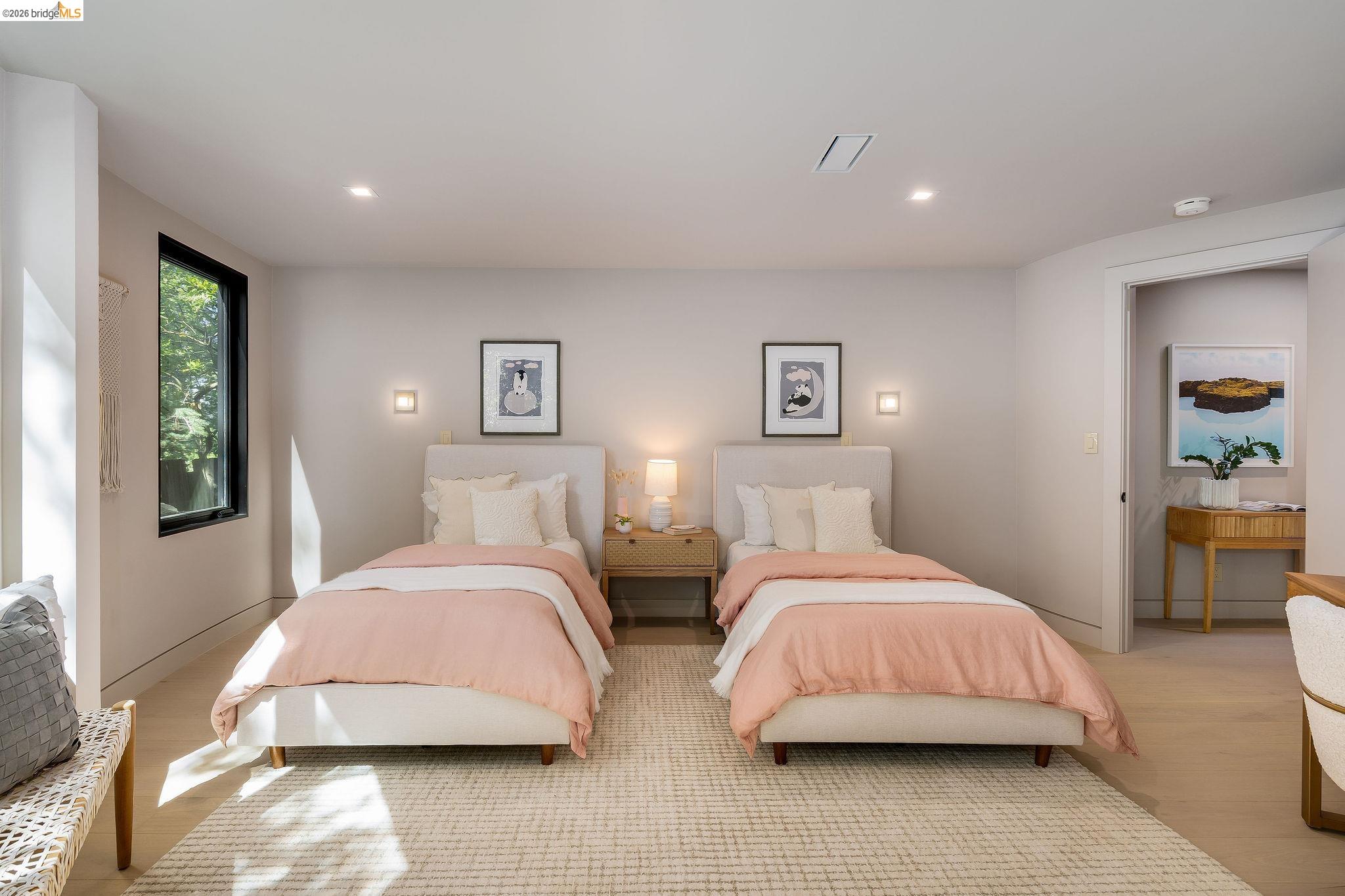 5645 Bacon Road Oakland, CA 94619 - Photo 60 of 94 Spacious room featuring light wood-finish flooring, recessed lighting, and a large window with black trim