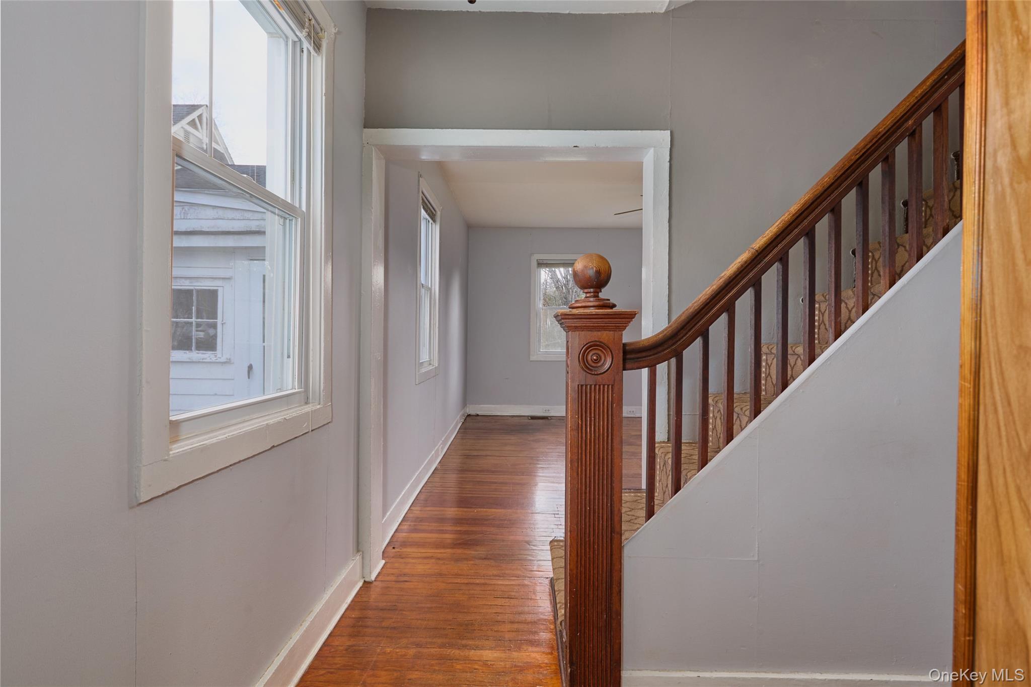 500 Haverstraw Road Suffern, NY 10901 - Photo 24 of 37 a view of a hallway with wooden floor and staircase