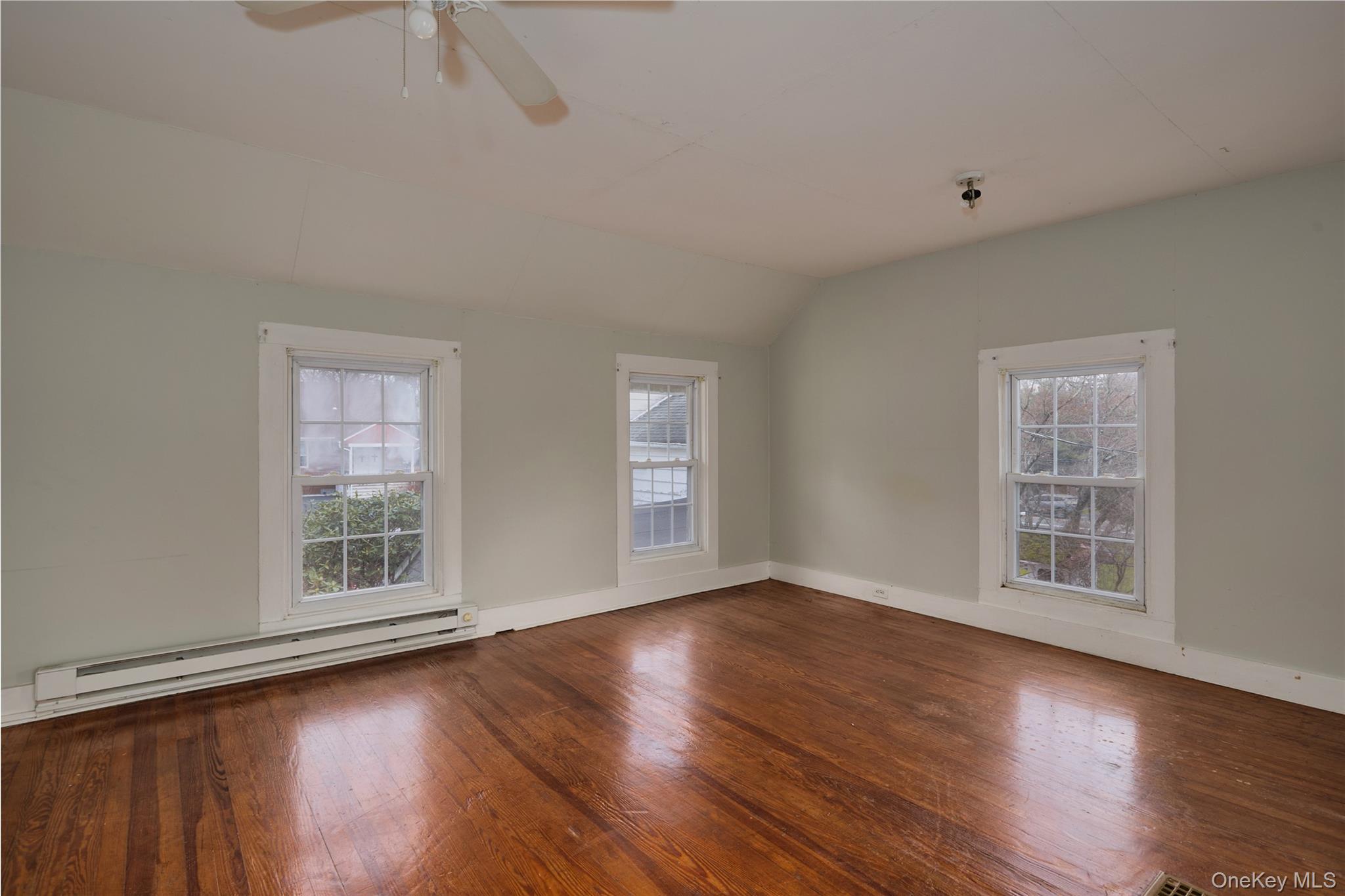 500 Haverstraw Road Suffern, NY 10901 - Photo 26 of 37 a view of an empty room with wooden floor and windows