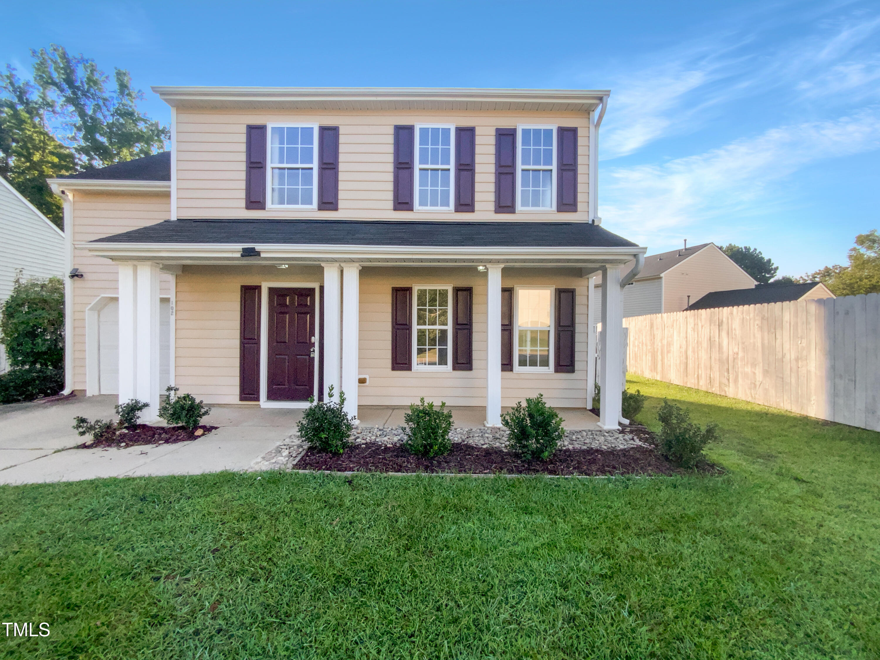 102 Spring Dove Lane Apex, NC 27539 - Photo 1 of 20 a view of a house with a yard and plants