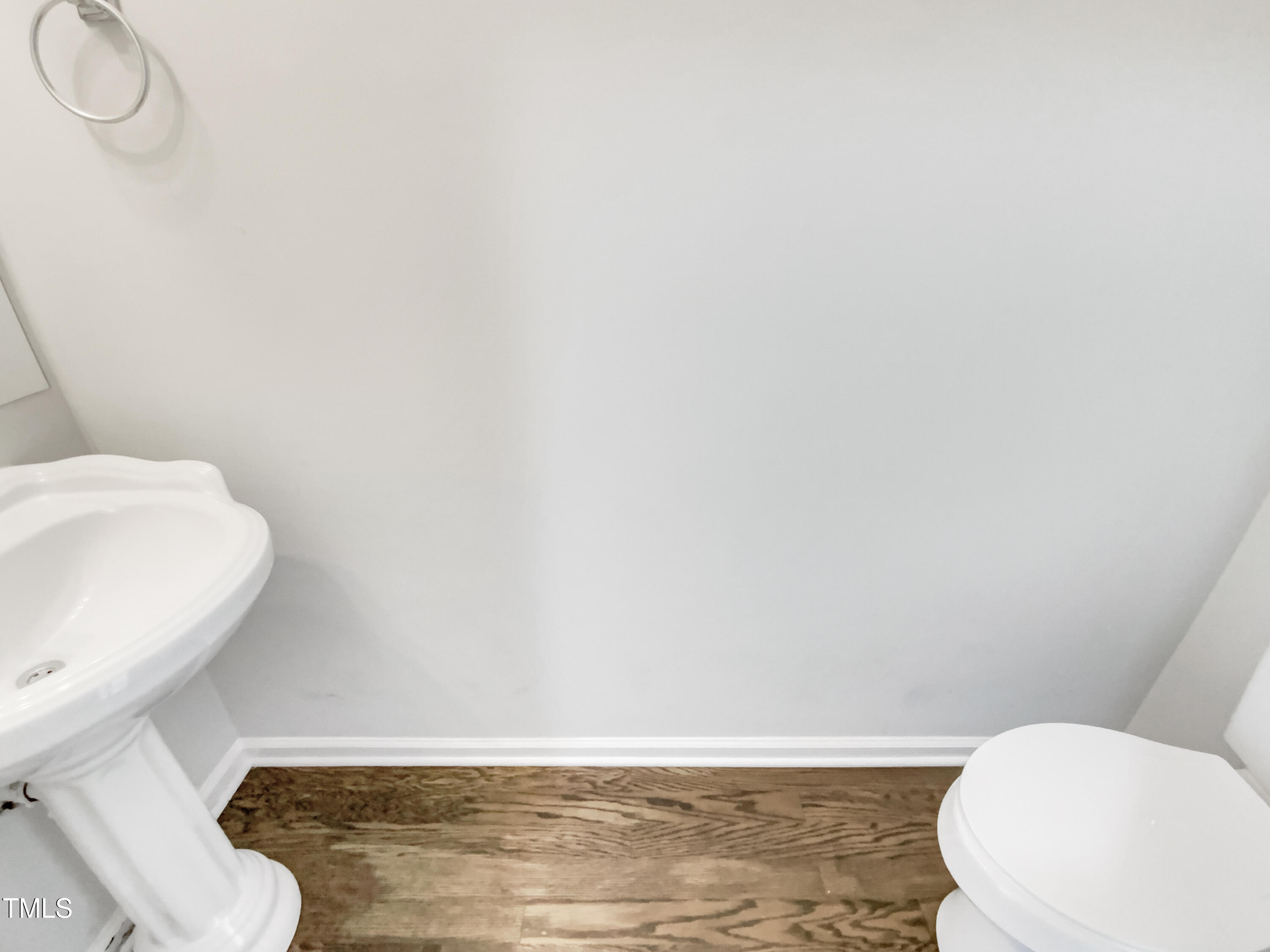 102 Spring Dove Lane Apex, NC 27539 - Photo 12 of 20 a bathroom with a toilet and a sink