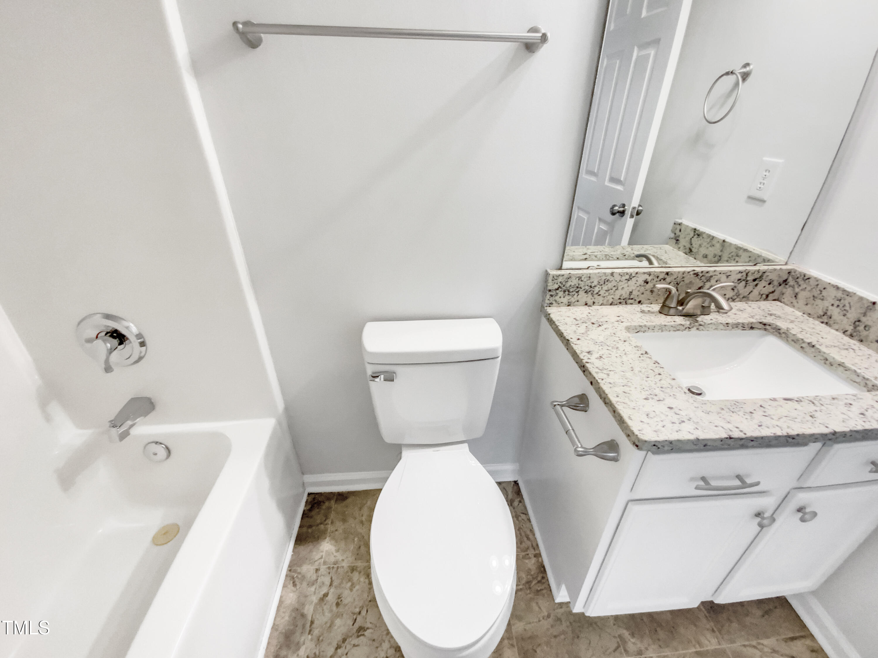 102 Spring Dove Lane Apex, NC 27539 - Photo 15 of 20 a bathroom with a granite countertop toilet sink and mirror