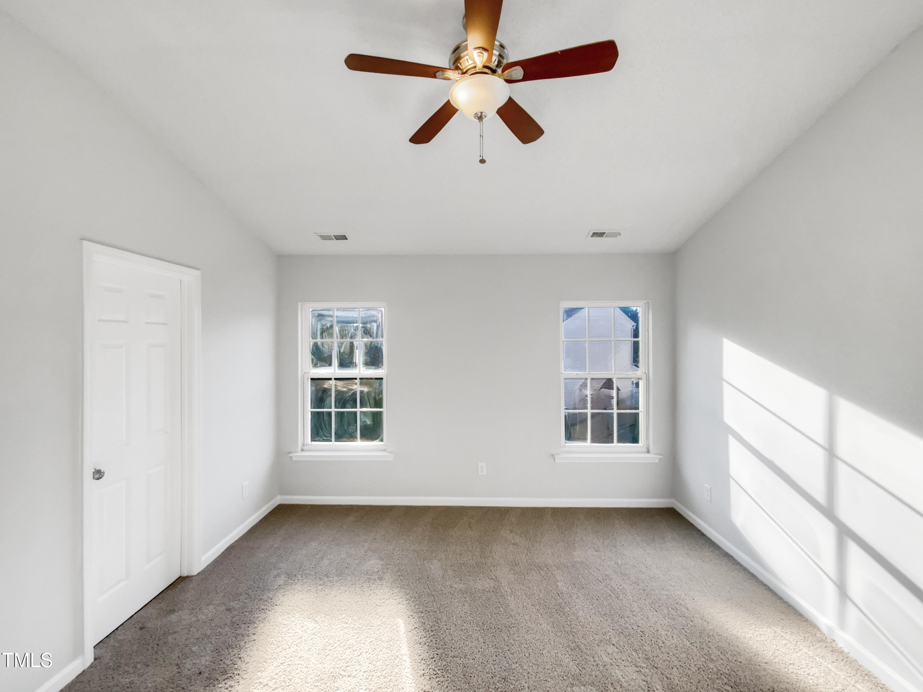 102 Spring Dove Lane Apex, NC 27539 - Photo 16 of 20 a view of an empty room with a window