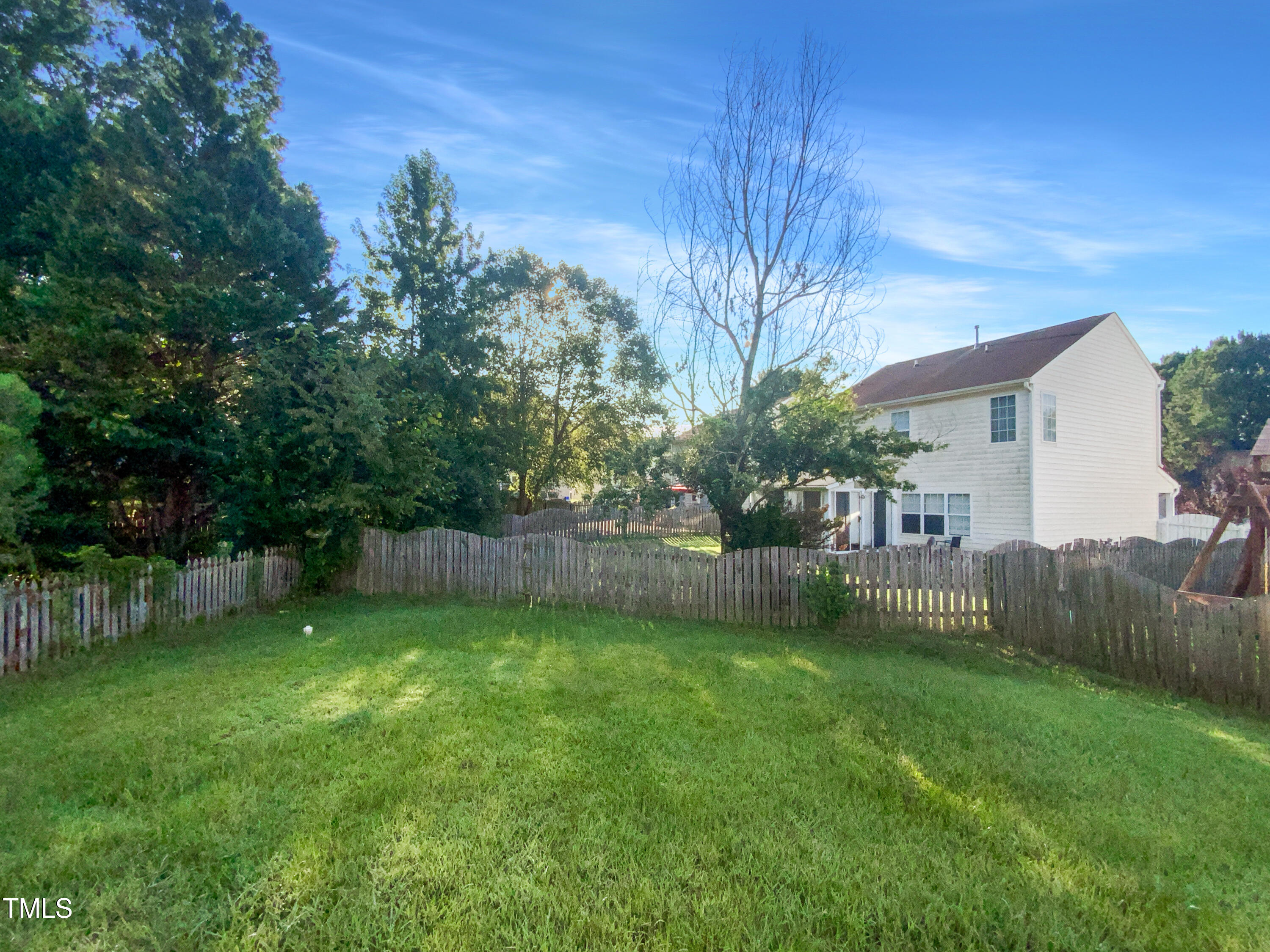 102 Spring Dove Lane Apex, NC 27539 - Photo 19 of 20 a view of a backyard with a garden