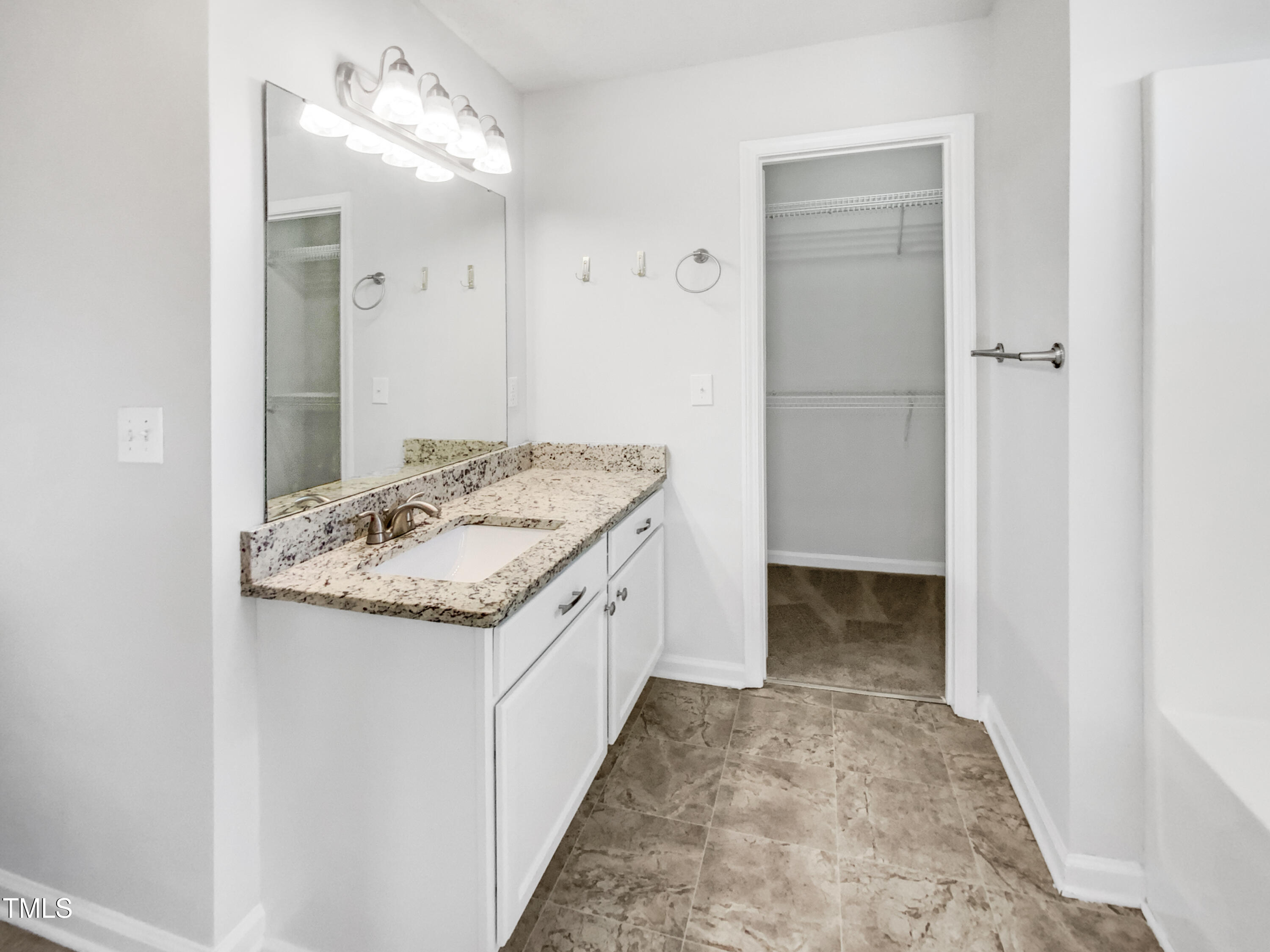 102 Spring Dove Lane Apex, NC 27539 - Photo 7 of 20 a bathroom with a granite countertop sink and a mirror