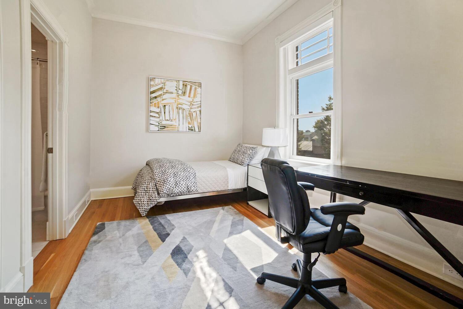 3348 Prospect Street Northwest, Unit 3 Washington, DC 20007 - Photo 6 of 13 a bedroom with a bed and a window