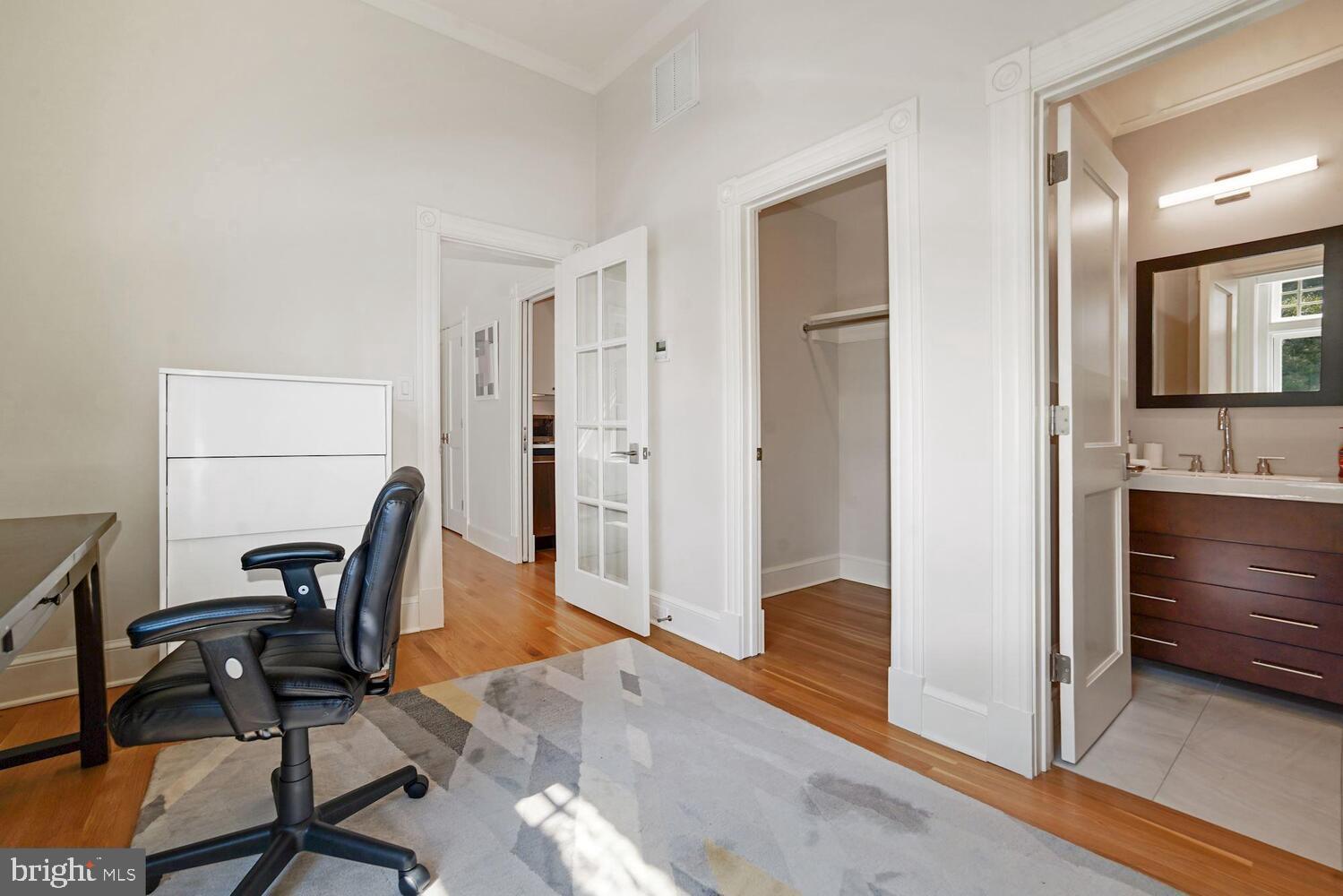3348 Prospect Street Northwest, Unit 3 Washington, DC 20007 - Photo 7 of 13 a view of a workspace with furniture and wooden floor