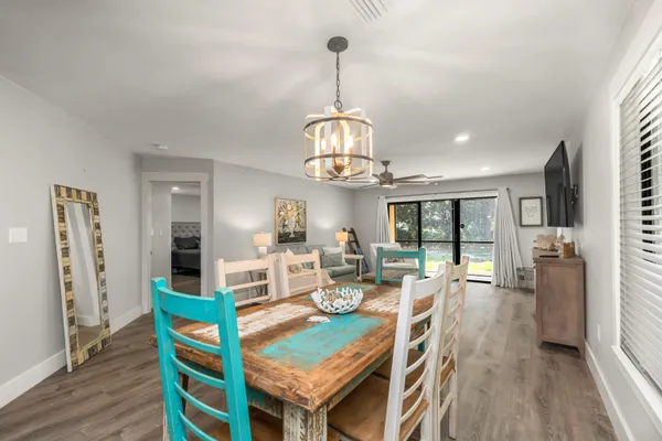 a view of a dining room with furniture window and wooden floor
