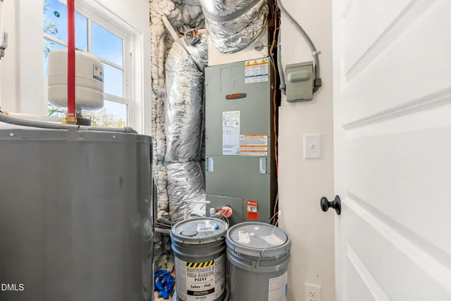 a bathroom with a toilet and a shower curtain