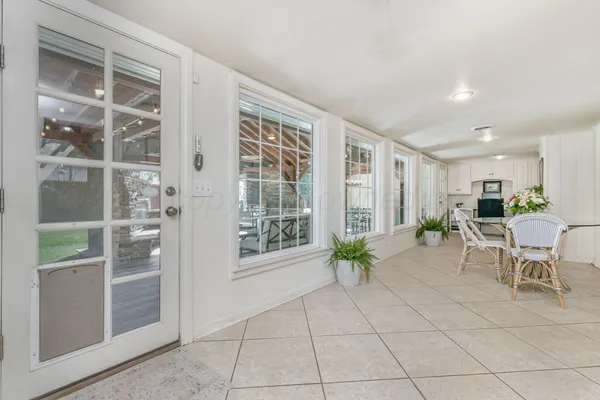 a bedroom with a bed and a bookshelf with wooden floor