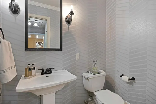 a view of a backyard with a garden and trees