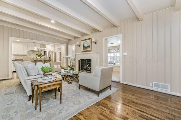 a kitchen with granite countertop white cabinets and stainless steel appliances