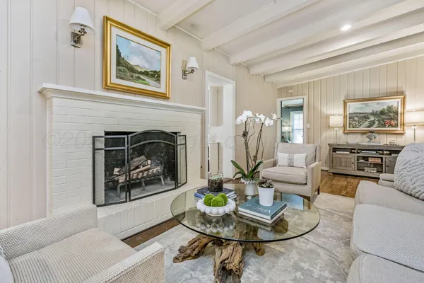 a kitchen with cabinets and chairs