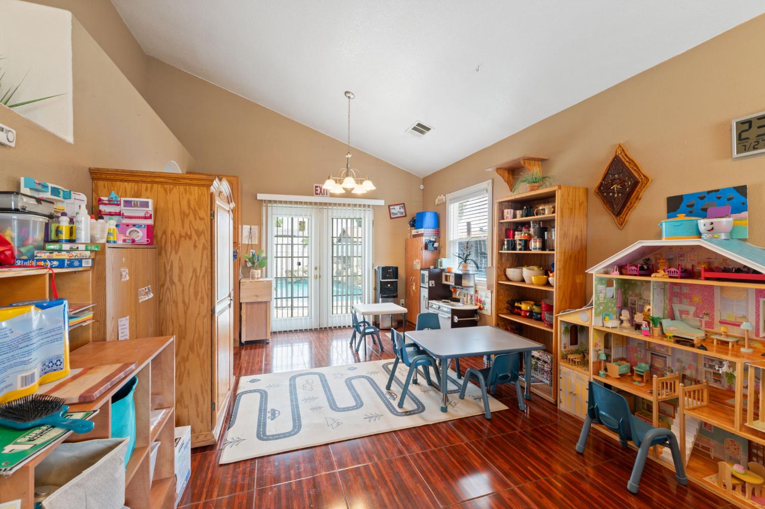 180 Cheney Lane Coalinga, CA 93210 - Photo 12 of 33 a living room with furniture and a book shelf