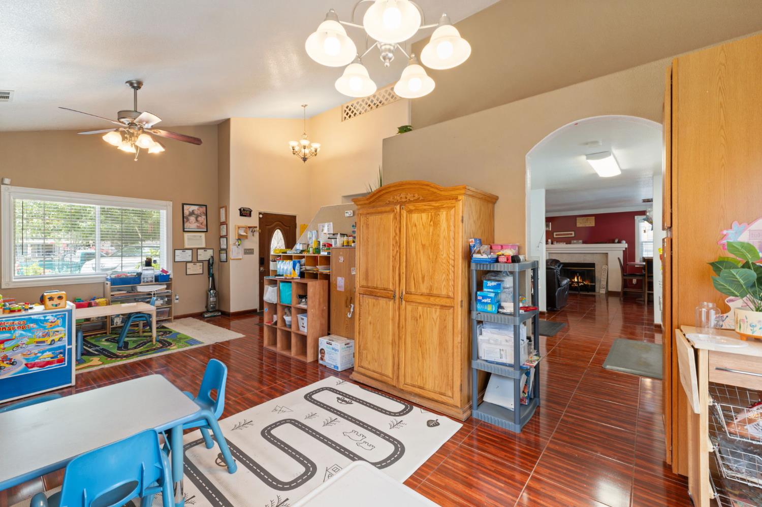180 Cheney Lane Coalinga, CA 93210 - Photo 13 of 33 a view of a dining room with furniture a chandelier and wooden floor