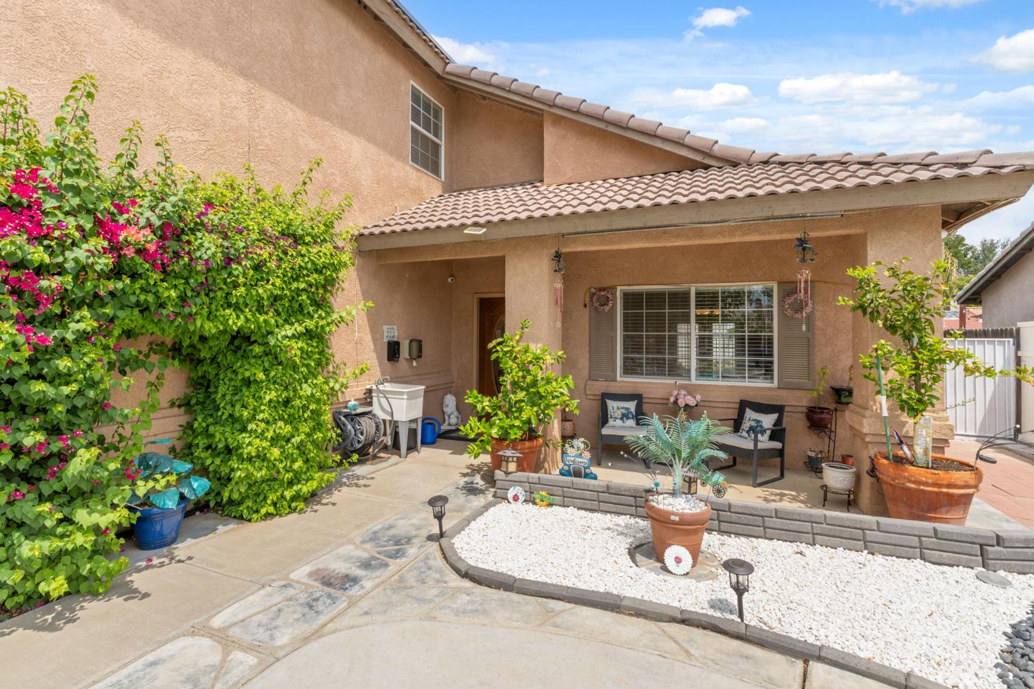 180 Cheney Lane Coalinga, CA 93210 - Photo 2 of 33 a front view of a house with outdoor seating
